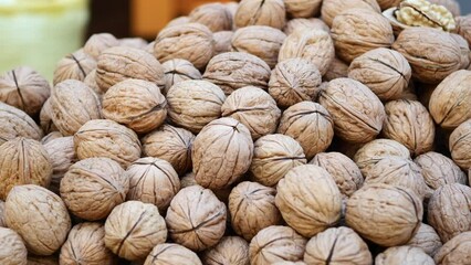 Sticker - stack of natural walnuts selling at shop 