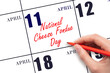April 11. Hand writing text National Cheese Fondue Day on calendar date. Save the date.