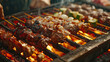 A closeup of a traditional Northeast Chinese charcoal grill, glowing coals under skewers of various meats and vegetables The grill master is turning the skewers expertly