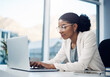 © peopleimages.com - Businesswoman, typing and laptop in office and working, corporate and online project for website. Internet, search and information on tech, reading email and report with web designer in workplace
