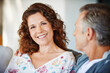 © peopleimages.com - Portrait, happy woman or mature couple in home living room for conversation or communication in marriage. Smile, pride or female person speaking to man in retirement or discussion to relax together
