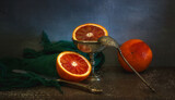 Fototapeta Natura - Still life with cut red orange.