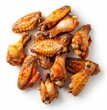   A stack of chicken wings arranged beside each other on a pristine white background One wing exhibits a telltale bite