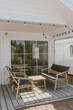 Farmhouse outdoor terrace or porch. Modern exterior design concept. Elegant cozy house for rent