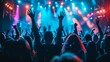 © Sasint - Silhouettes of a multicultural group cheering at a concert, with stage lights illuminating their figures