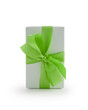 White gift box with green ribbon bow isolated on white background