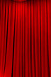 red theater curtain that dropped down as a straight line. Background for inserting text, empty spaces.	
