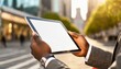 © Eggy - Tablet held by Man in Outside in the City - Mockup for Application or Web Design - Template for Presentation of Graphic Design - Corporate Representation at Consumers