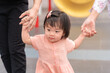Asian girl daughter holding family hand, Family concept