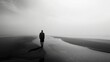© Costas Visuals - Lonely man walking on a foggy beach. Copy Space.
