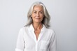 © Stocknterias - Portrait of senior woman with grey hair. Isolated on grey background