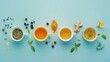 Picture a creative flat lay layout featuring an assortment of teas and ingredients arranged on a light blue background, forming a visually appealing composition that celebrates the diversity of flavor