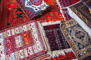 Poster - traditional oriental Turkmen handmade carpets at the bazaar in Turkmenistan