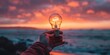 © RamvijayB - Illuminating Ideas: Conceptual Image of Person Holding Light Bulb at Sunset generative ai