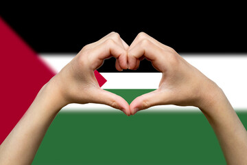 Wall Mural - Palestine flag with two hands heart shape, patriotism and nationalism idea, express love or 