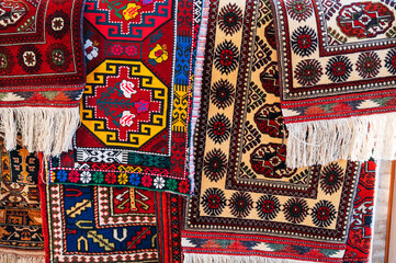 Poster - Colorful expensive modern oriental Arabic carpets on oriental bazaar in Uzbekistan