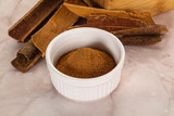 Fototapeta Kuchnia - Natural Cinnamon powder with sticks