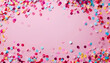 Frame made of colorful confetti on pink background