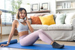 © Art_Photo - Portrait of sport slim fit strength asian woman training in sportswear relax and practicing yoga, fitness, exercise, wellness, workout, sport at home.Diet concept.Fitness and healthy lifestyle