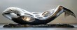 A contemporary abstract sculpture of a whale, featuring sleek, curved lines and polished surfaces. 