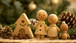 Wooden figurines and a house, with pine cones and festive greenery, evoke holiday warmth and family joy.