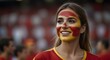 Happy SPAIN woman supporter with face painted in SPAIN flag , SPAIN fan at a sports event such as football or rugby match euro 2024, blurry stadium background