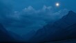   A full moon illuminates the mountain range at night, its peaks outlined against the inky backdrop Few clouds scatter across the velvet sky