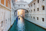 Fototapeta  - View of the gondolas of the Grand Canal on a sunny day in Venice, Italy. Bridge of Sighs.