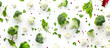 Decorative composition of appetizing pieces of broccoli and cauliflower on white surface. Decorative still life