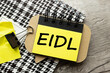 EIDL The Economic Injury Disaster Loan Program. bright sticker with text on a notebook.