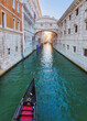 View of the gondolas of the Grand Canal on a sunny day in Venice, Italy. Bridge of Sighs.