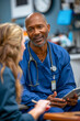 © Pompozzi - Healthcare Professionals Discussing Work on Tablet