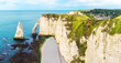 Panoramic view of white chalk cliffs and natural arches Aval and Needle of Etretat and beautiful famous coastline during low tide, Normandy, France. French sea coast in Normandie