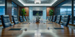 © GR - A spacious conference room with a long table surrounded by comfortable chairs for meetings and discussions.