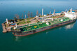Aerial view of ship tanker vessel loading in gas and oil terminal station refinery, Global trading import export logistic transport sea freight cargo tanker at port in Batumi, Georgia