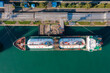 Aerial top down view ship LPG tanker vessel loading in gas and oil terminal station refinery, Global trading import export logistic transport sea freight Liquefied Petroleum Gas tanker
