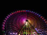 Fototapeta Uliczki - Spectacular Ferris Wheel Light Show: A Carnival of Colors