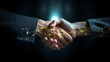  Two individuals are shaking hands in agreement over a solid black background. The handshake symbolizes mutual respect and understanding between the two parties.