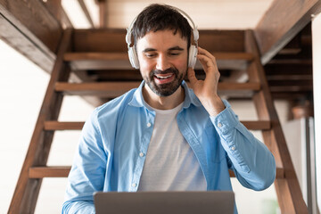 Aufkleber - Man Wearing Headphones Using Laptop, Home Interior
