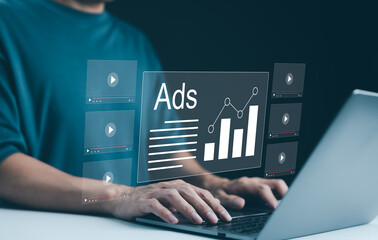 Wall Mural - digital advertising analytics and video ads campaigns. person using laptop analyzing digital ad perf