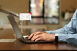 © New Africa - Email. Man using laptop indoors, closeup. Incoming letter notification near device