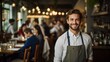 © Adobe Contributor - Portrait of a happy young waiter in a restaurant