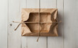 A brown paper box with a string tied to it