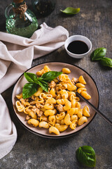 Wall Mural - Navy pasta with ground meat in a plate on the table vertical view