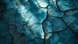Intriguing shadows interact with the blue cracked paint texture creating a dynamic image