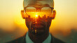 double exposure image of a dark skinned man with a cityscape at sunset