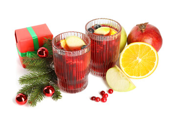 Wall Mural - Aromatic Sangria drink in glasses, ingredients and Christmas decor isolated on white