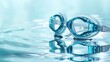 © Татьяна Макарова - Swimming goggles on clear water surface with reflections