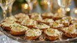 A tray of bitesized appetizers made with nonalcoholic wine sauce and melted gruyere cheese is passed around a party receiving approving nods and smiles.