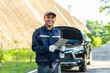 © BJ Day Stock - Happy asian automobile mechanic repairman wearing uniform and holding tablet, He standing and smiling to camera After repairing the car, car service and maintenance, Repair service.